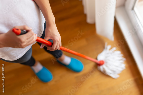 Woman wiping a floor