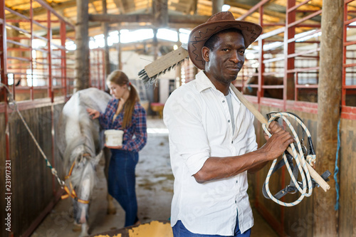Portrait afro man horse farm worker