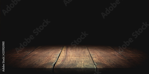 Wood table in the dark background.