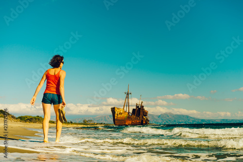 Tourist woman on beach enjoying vacation