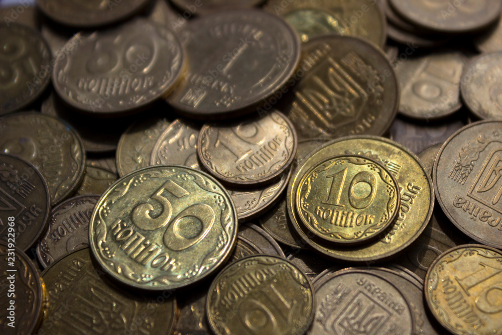 Ukrainian coins, many money - hryvnia and a penny, background Ukrainian coins, many money - hryvnia and a penny, background
