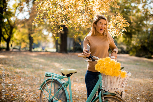Happy active woman riding b...