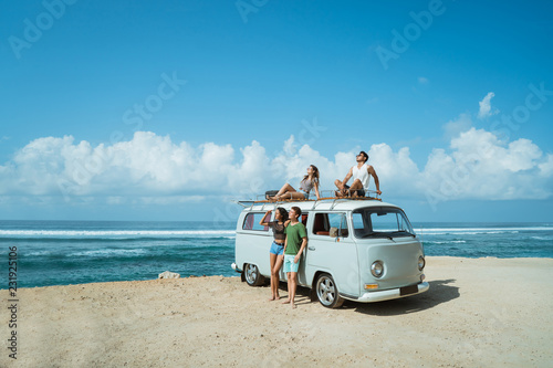 Group of young cheerful and smiling while leaning at retro style photo