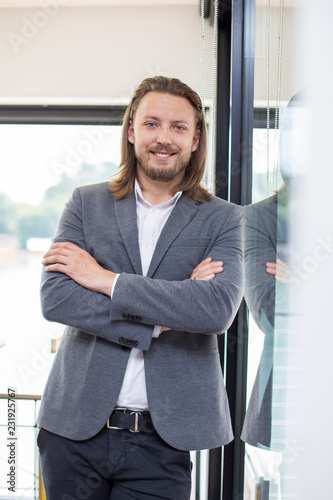 Portrait of happy businessm...