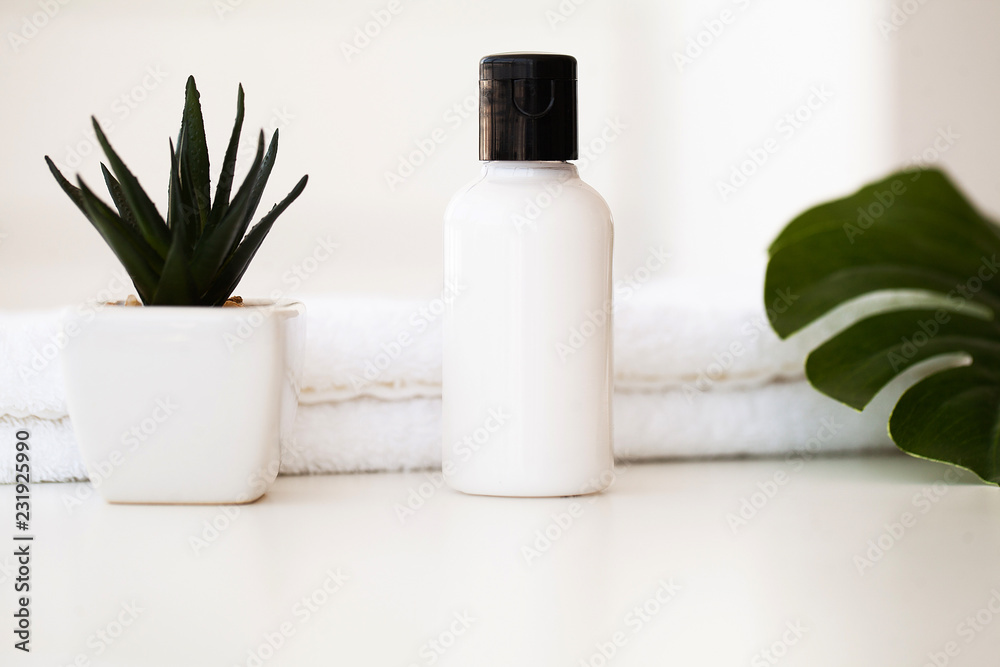 Wellness Products and Cosmetics. Spa still life with blossoms of rose and essential oils Wellness Products and Cosmetics. Spa still life with blossoms of rose and essential oils