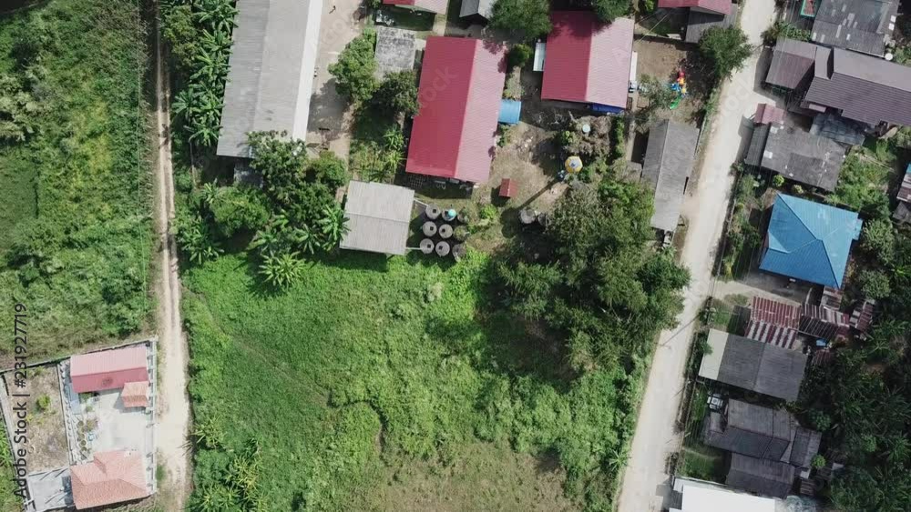 Aerial view of a rural school with red roofs and soccer field in Thailand Aerial view of a rural school with red roofs and soccer field in Thailand