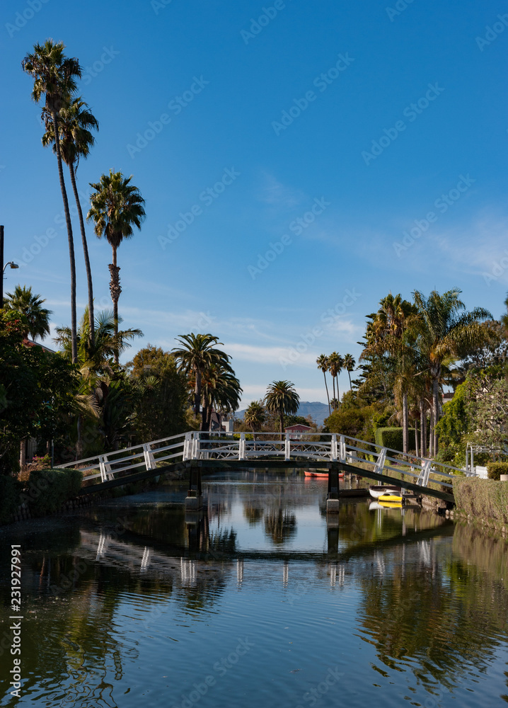 Pedestrian bridge crossing on the venice canals near los Angeles, California Pedestrian bridge crossing on the venice canals near los Angeles, California