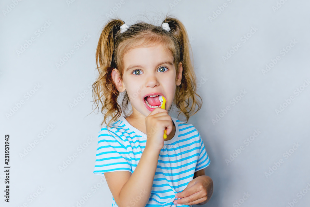 children's dental hygiene. child brushes his teeth with a toothbrush. health care, dental hygiene, people and beauty concept. mockup, free spase. selective focus. children's dental hygiene. child brushes his teeth with a toothbrush. health care, dental hygiene, people and beauty concept. mockup, free spase. selective focus.