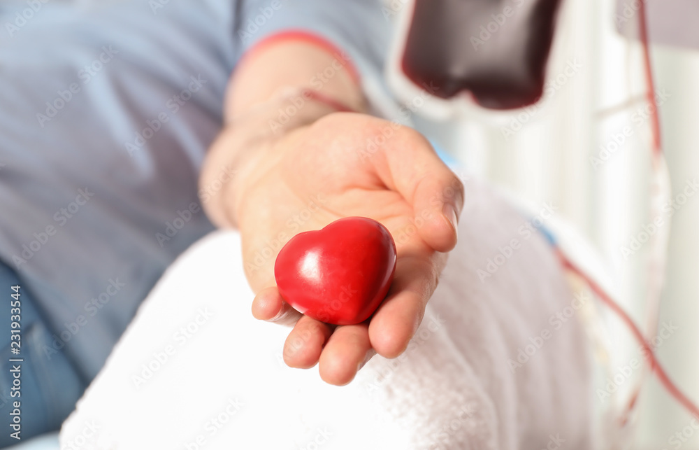 Man donating blood to save someone's life in hospital Man donating blood to save someone's life in hospital