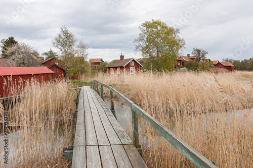 Canvas Print red swedish houses in Harstena, a little fishing village in the Gry skerry garde