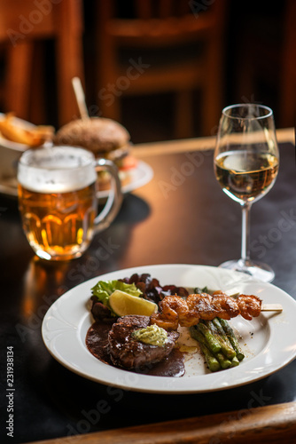 american hamburger with glass of beer of wine in american restaurant, product photography for restaurant in american style