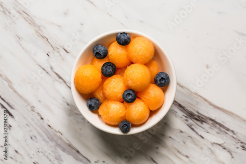 Cantaloupe and blueberries photo