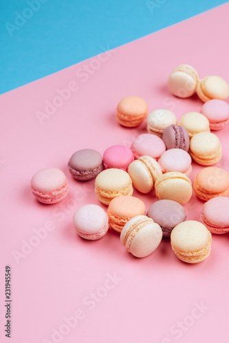 Cake macaron or macaroon on pink and blue background., flavor almond cookies, pastel colors, vintage card