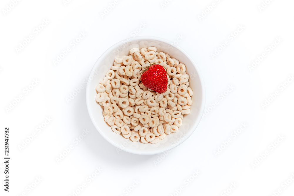 oat rings cereal with strawberry. bowl of cereal with berries on a white background. flat lay, top view - obrazy, fototapety, plakaty 