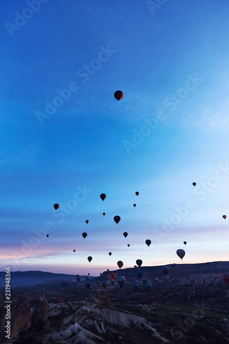 Mountain landscape with large balloons in a short summer season at dawn.