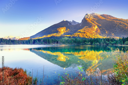 Hintersee - Amazing Alpine Lake in Germany, Bavaria Bundes land, Austria border. Picturesque scenery of lovely sunrise on the lake in Alps mountains. Scenic Seasonal Autumn Landscape Photography.