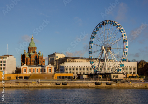 The skyline of the capital Helsinki on a sunny day, Finland. View from the ocean on the Uspenski cathedral.