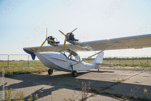 Fototapeta Naklejka Na Ścianę i Meble -  Light twin-engine amphibious aircraft at the airport