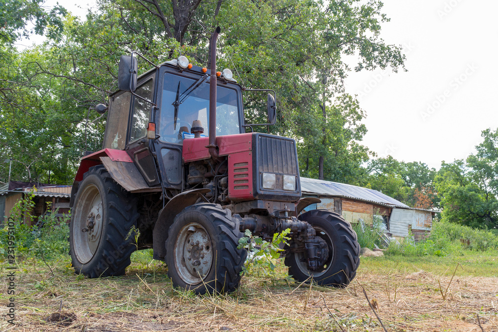 Tractor for working in the field and mowing grass Tractor for working in the field and mowing grass