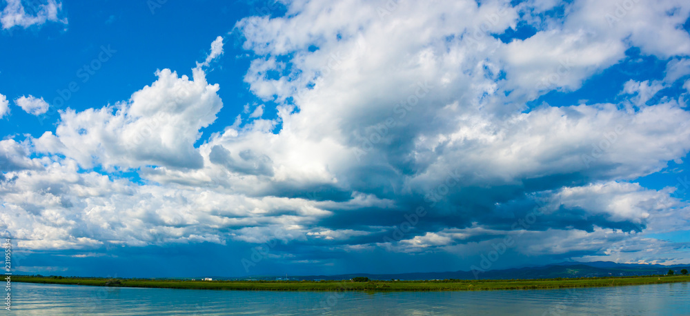 Blue sky and thunderstorm