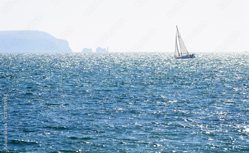 Fototapeta premium Sailing yacht at sea off the Needles, Isle of Wight, Hampshire, England, UK.