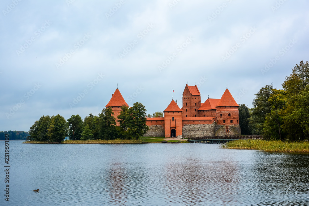 Fototapeta premium Ancient castle on island in middle of lake. Trakai Island Castle historical landmark, Lithuania.