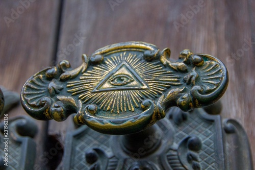 фотографія All seeing eye of illuminati on a door knob of the Illuminati freemason in Stockholm, Sweden