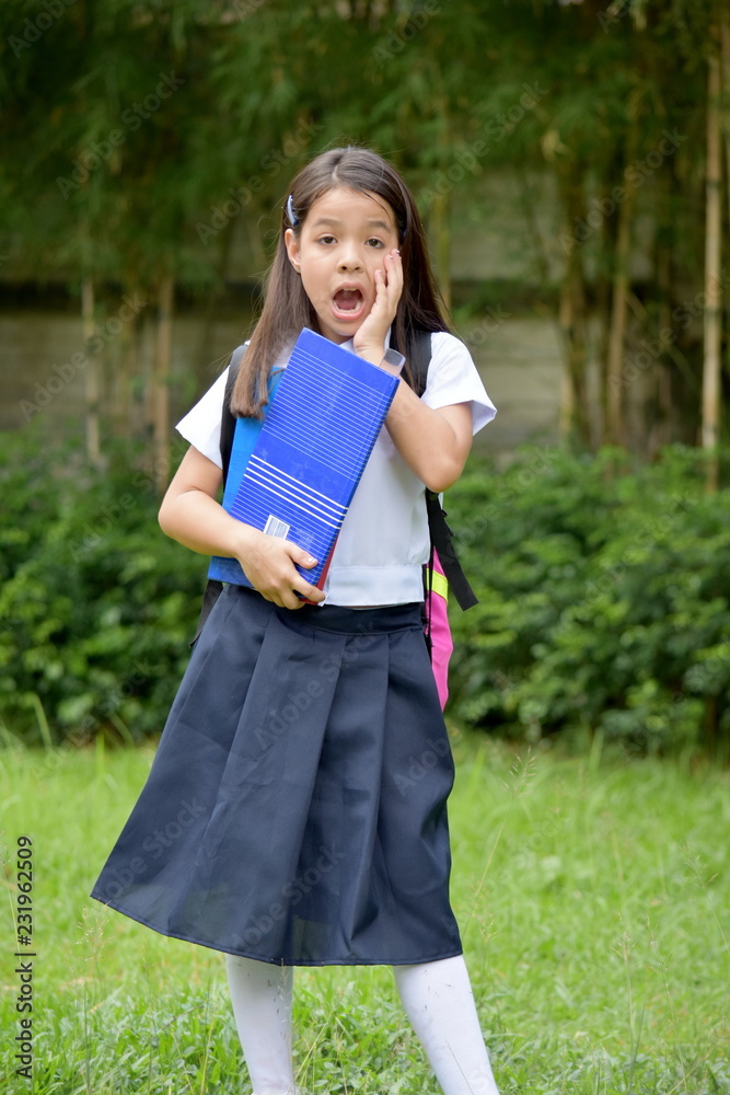 Startled Young Diverse Person Wearing Uniform With Notebooks
