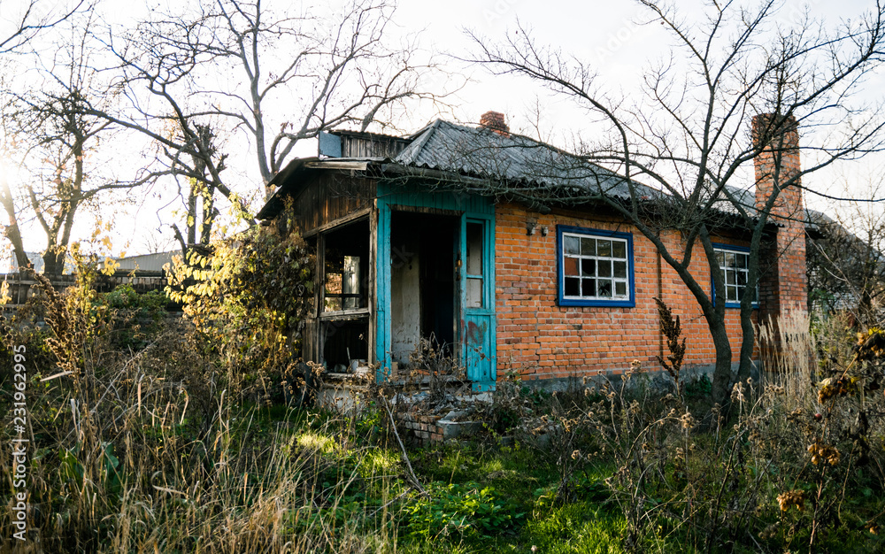 Old abandoned brick house among the autumn old garden Old abandoned brick house among the autumn old garden