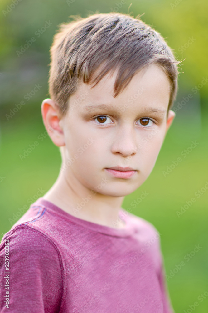 Portrait of a boy in the summer outdoors Portrait of a boy in the summer outdoors