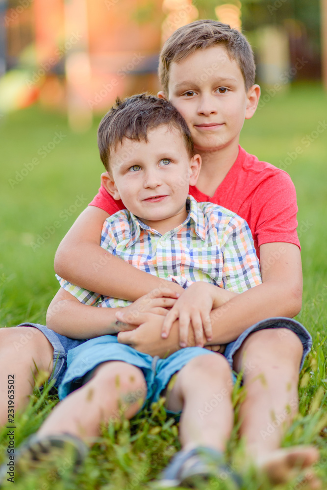 Portrait of two boys in the summer outdoors Portrait of two boys in the summer outdoors