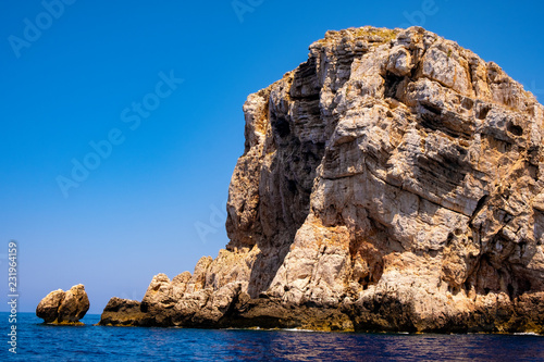 Alghero, Sardinia, Italy - Rocky islands and limestone cliffs of the Capo Caccia cape at the Gulf of Alghero