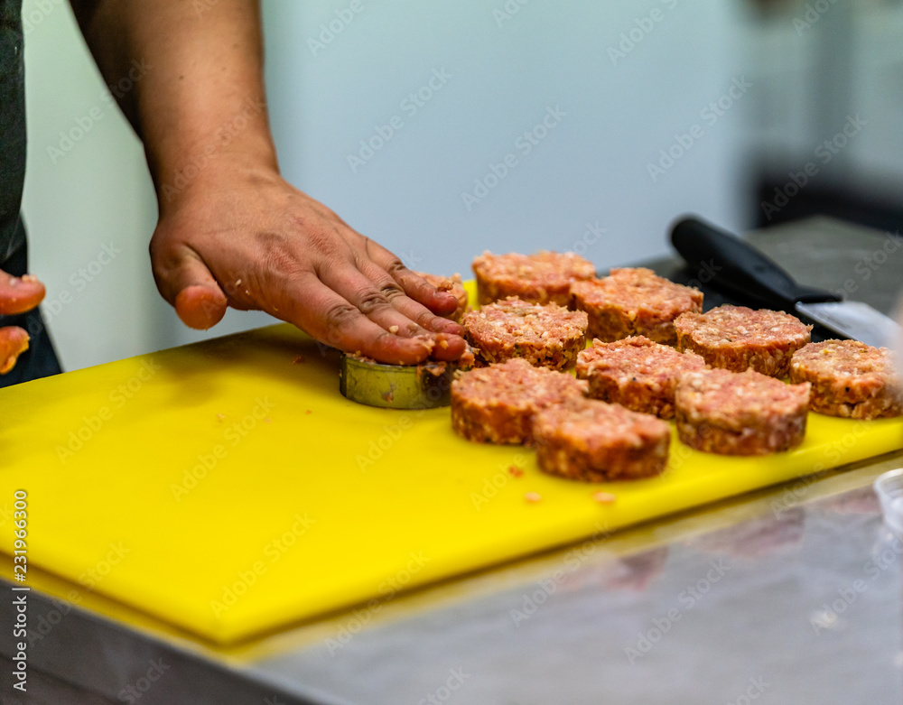 Female Chef Making Round Pork Cutlet for Some Burgers for  Wedding Meal