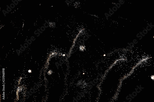 Fireworks in the night sky. Texture salute. Abstract photo of flares on a black background. Photos of lights salute in the sky. Image of salute flashes. Texture of colored lights.