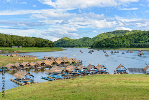 Beautiful natural landscape of the river, mountain, sky, green forest and bamboo raft shelter is part of the floating restaurant at Huai Krathing is a tourist attraction of Loei province, Thailand photo