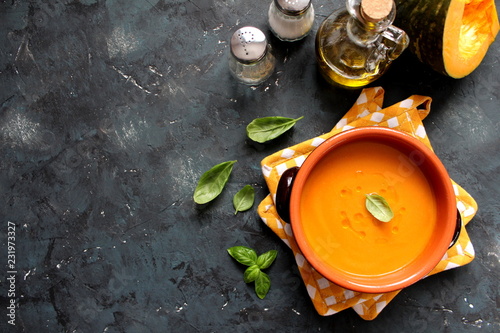 Vegetarian and vegan pumpkin cream soup. Top view with copy space. Diet food. photo