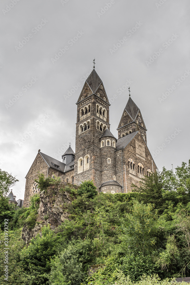 beautiful view of the Church Saints Cosmas and Damian with a gray sky in Clervaux Luxembourg