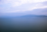 wallpaper soft nature scenery landscape of morning foggy mountain silhouette near sea bay calm water surface