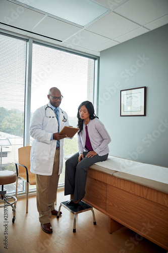 Doctor speaking with female patient