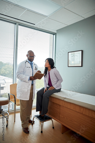 Doctor speaking with female patient
