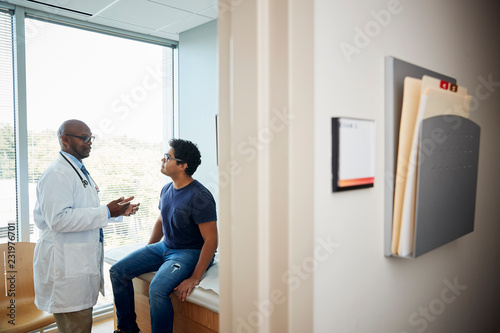Doctor talking with male patient