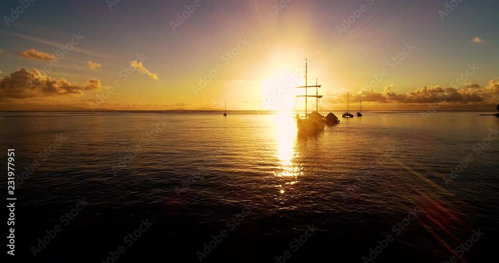 boat with Sunset in aerial view , french polynesia boat with Sunset in aerial view , french polynesia