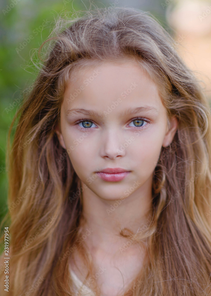 portrait of little girl outdoors in summer portrait of little girl outdoors in summer