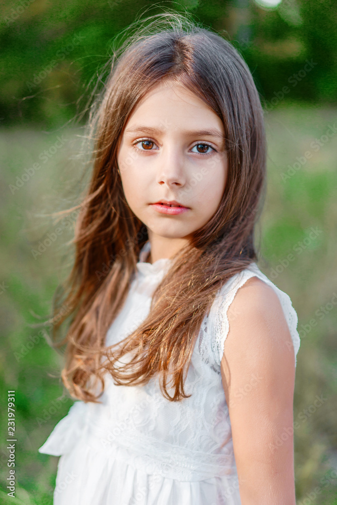 portrait of little girl outdoors in summer portrait of little girl outdoors in summer