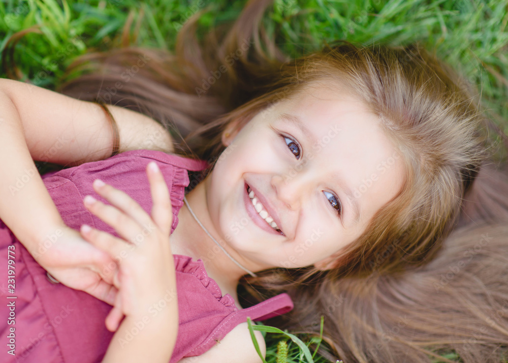 portrait of little girl outdoors in summer portrait of little girl outdoors in summer