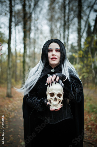 Picture of witch girl with skull in hands