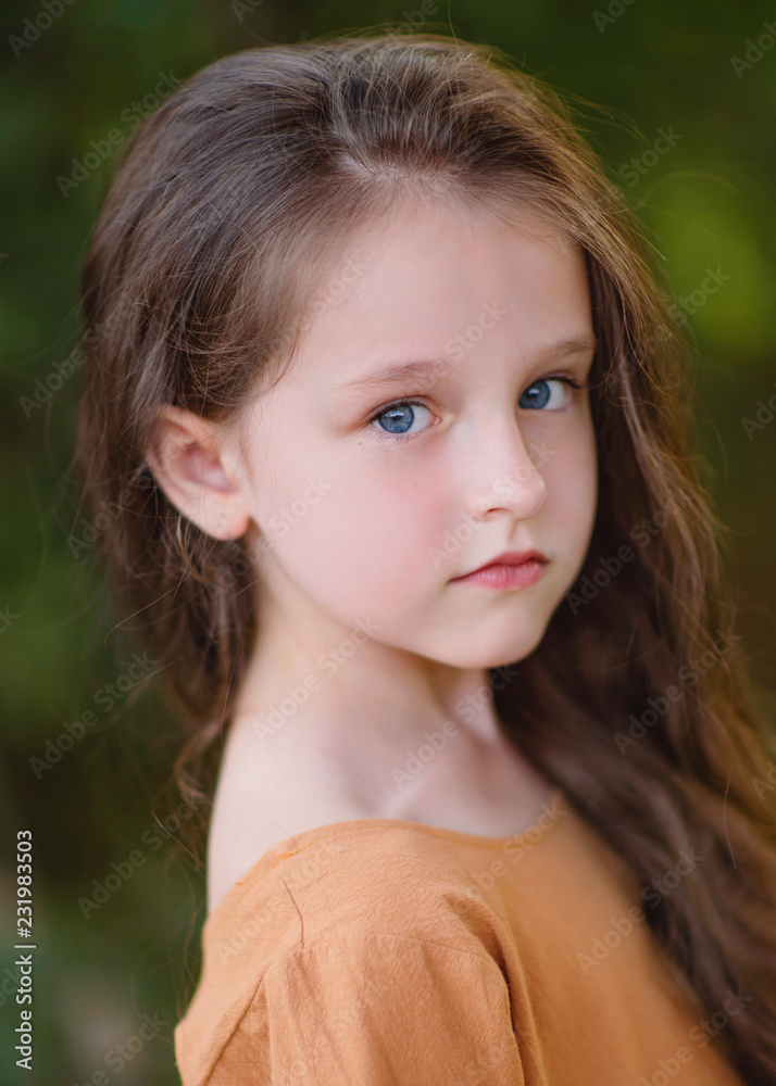 portrait of little girl outdoors in summer portrait of little girl outdoors in summer