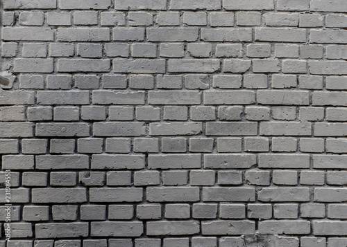 Grunge industrial grey painted brick wall background in Kyiv, Ukraine. May be used in design and interiors.