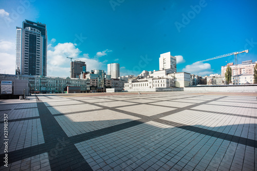 Olimpiyskiy square with paving stones and nobody on shot with big dynamic range, blue sky and colorful space