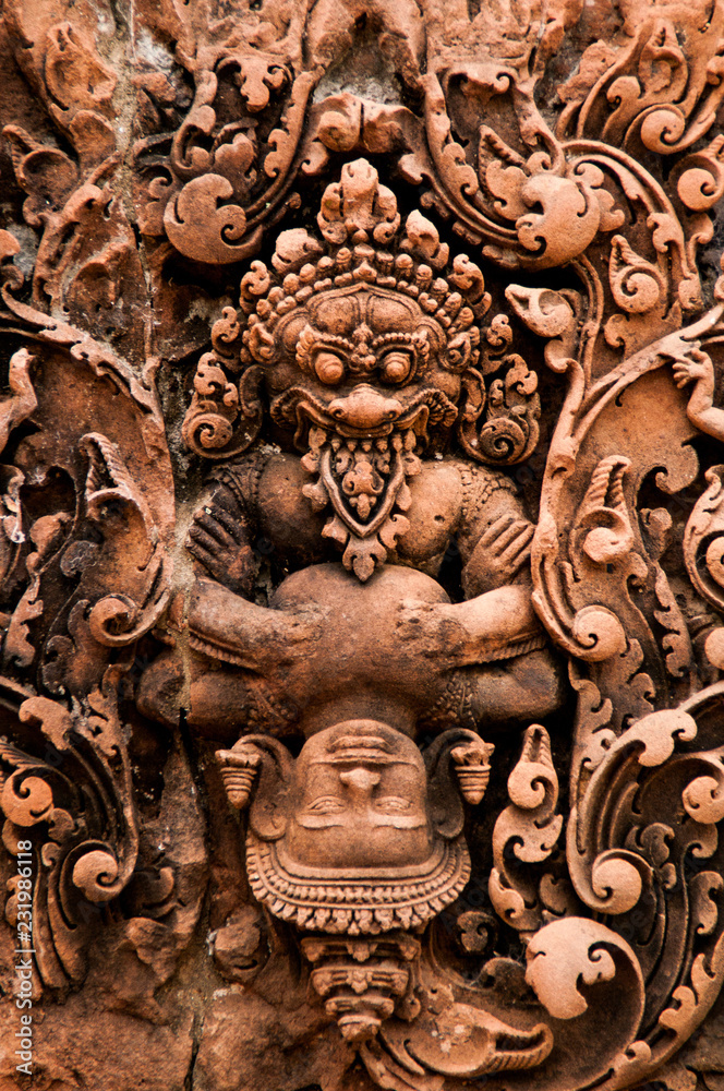 Wall carving at Angkor Wat - dominating god